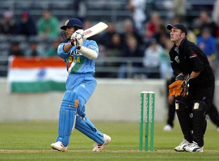 Tendulkar lofts a delivery down the ground as Nevin looks on. Super Max International: New Zealand v India at Christchurch, 4 Dec 2002