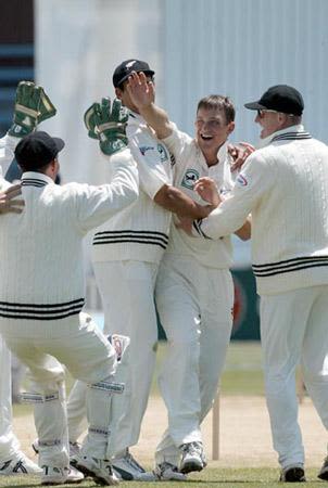Members of the New Zealand team celebrate the dismissal of Ganguly. 1st Test: New Zealand v India at Wellington, 12-16 Dec 2002