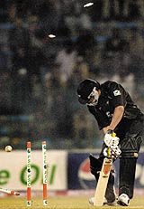 New Zealand batsman Tama Canning is clean bowled off Pakistani pace bowler Mohammad Sami