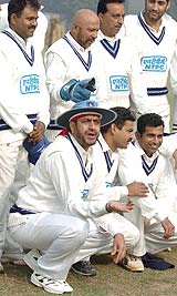 Indian Veterans pose before a match