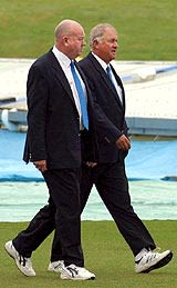 Dave Orchard and Steve Davis during a pitch inspection