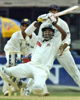 Manjural Islam Rana plays a peculiar stroke on bended knees