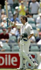 Justin Langer gets his second fifty of the match