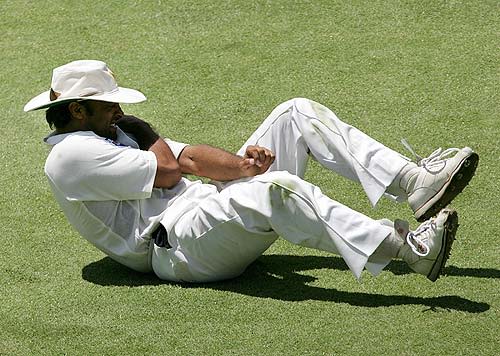 Shoaib Akhtar grimaces with pain after hurting his left shoulder