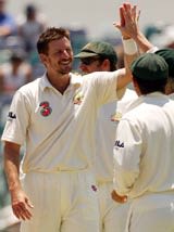 Michael Kasprowicz celebrates a wicket